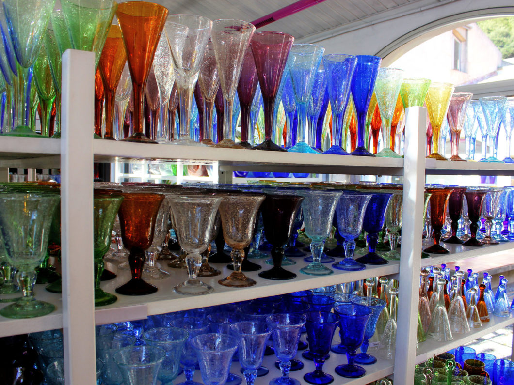 Biot Glass. Colorful glasses of french bubbles glass in the shop