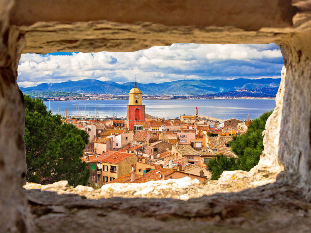 Saint Tropez village church tower and old rooftops view through